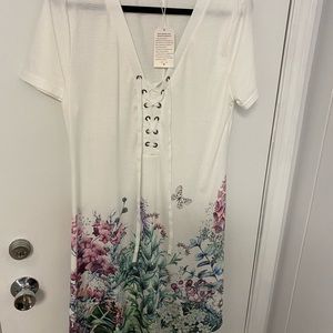 White casual dress or beach cover up. Comfortable light weight stylish!